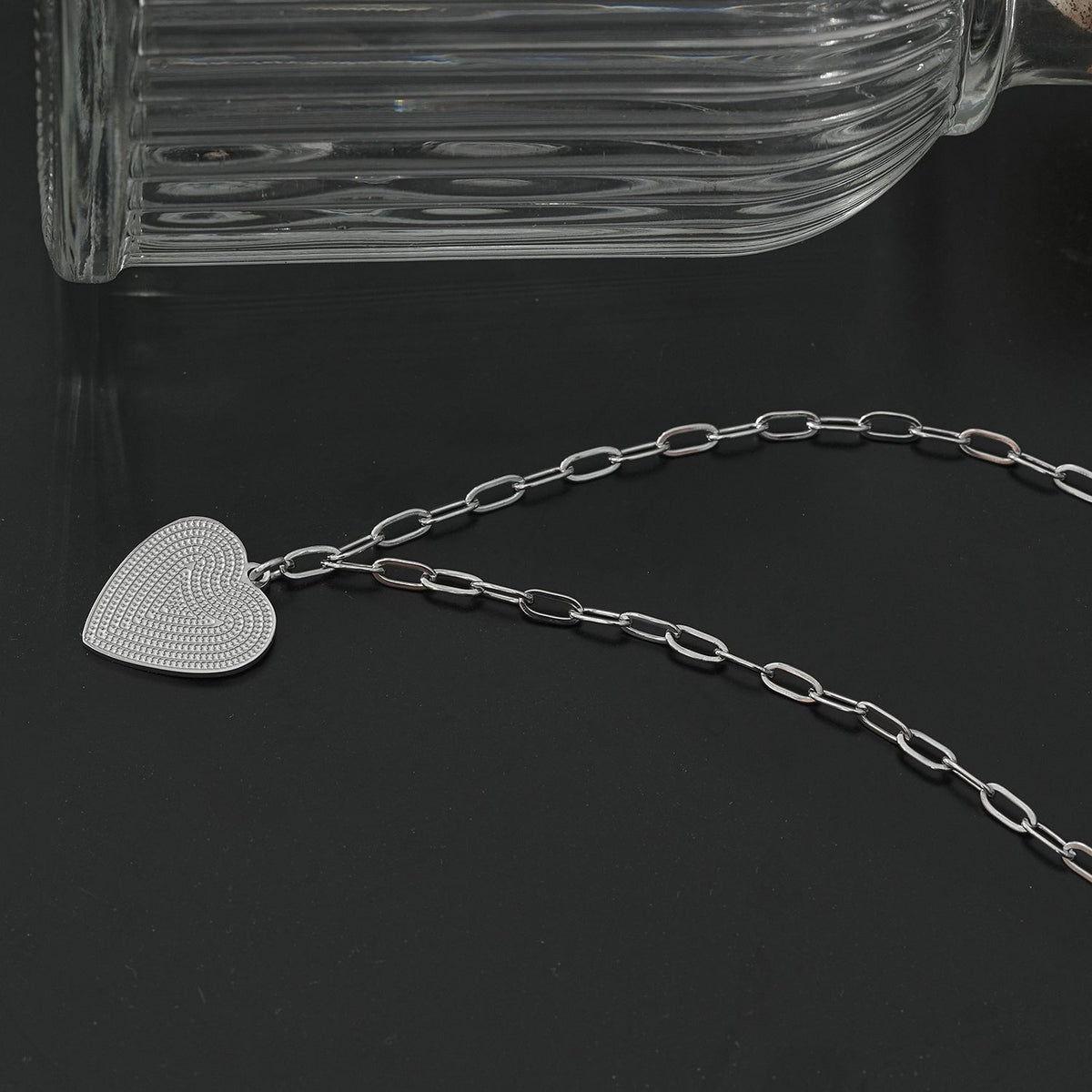 Style ALARA : Mini chaîne trombone ancrant un charm cœur à motifs en argent