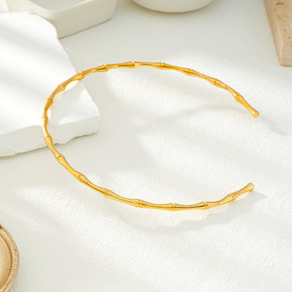 BENONI Gold: Collier ras du cou texturé bambou.