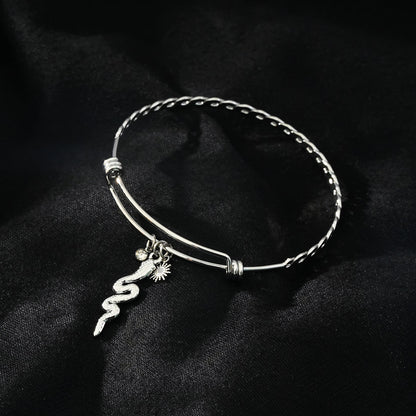 CATALINA Or Blanc (ton argenté) : Bracelet avec Breloques Serpent, Symbole Solaire et Zirconia (CZ).