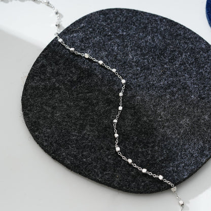 DEMELZA LG : Cheville contemporaine en argent avec de délicates perles carrées