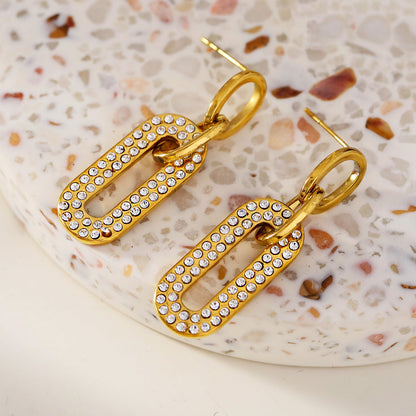 LAIA : Boucles d'oreilles de forme rectangulaire arrondie serties de pierres de zircone