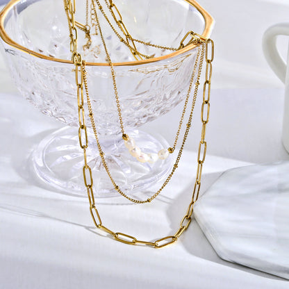 MARLI 3-Layer Multi Chain Gold Necklace featuring Natural Pearls