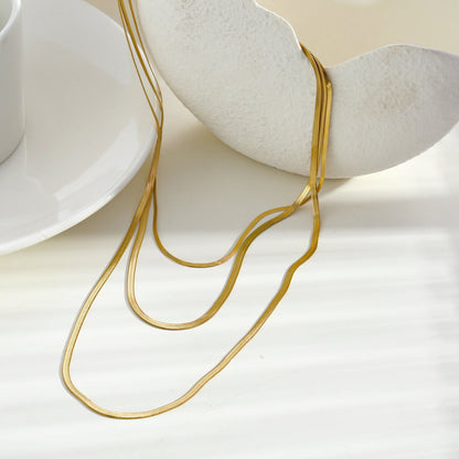 NALA : Collier doré triple couche effet peau de serpent