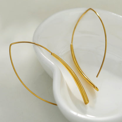 XIMENA: Boucles d'oreilles créoles dorées à courbes géométriques