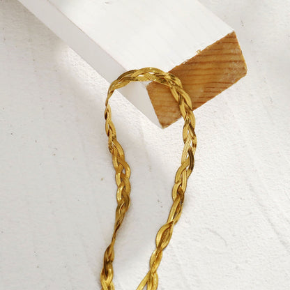 TARA Gold : Collier texture peau de serpent à chevrons entrelacés.