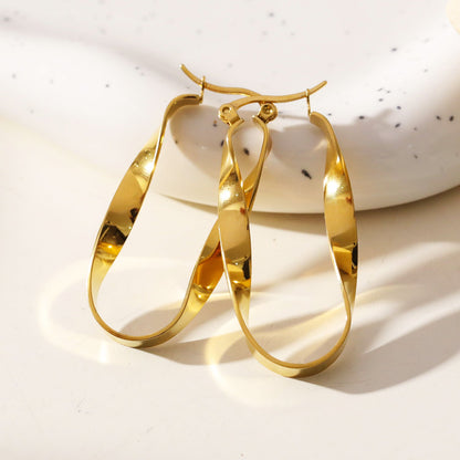 Boucles d'oreilles créoles semi-imposantes oblongues abstraites torsadées GISELA