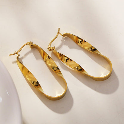 Boucles d'oreilles créoles semi-imposantes oblongues abstraites torsadées GISELA