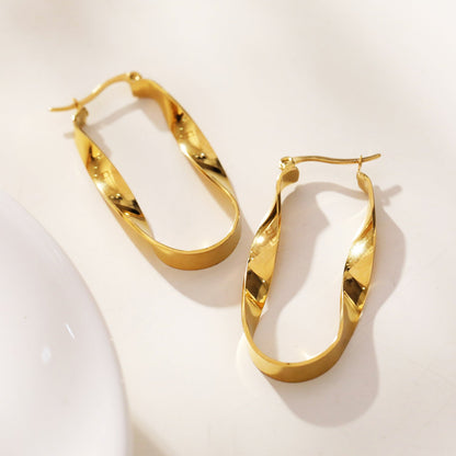 Boucles d'oreilles créoles semi-imposantes oblongues abstraites torsadées GISELA