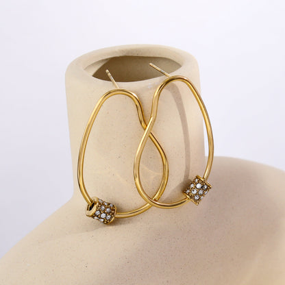 Boucles d'oreilles créoles irrégulières SIMAN avec pavé de zircones en or