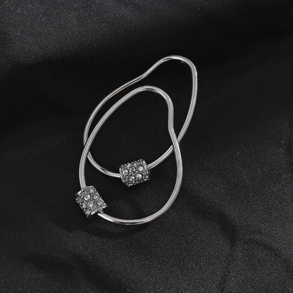 Boucles d'oreilles créoles SIMAN en argent avec pavé zircone de forme irrégulière