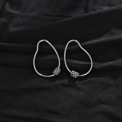 Boucles d'oreilles créoles SIMAN en argent avec pavé zircone de forme irrégulière